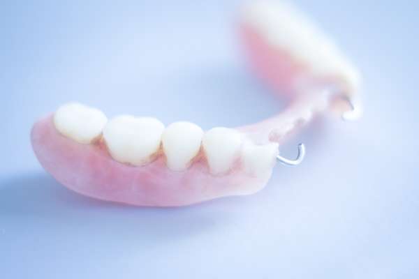 Should I Get Dentures or Dental Implants from Gables Exceptional Dentistry in Coral Gables, FL